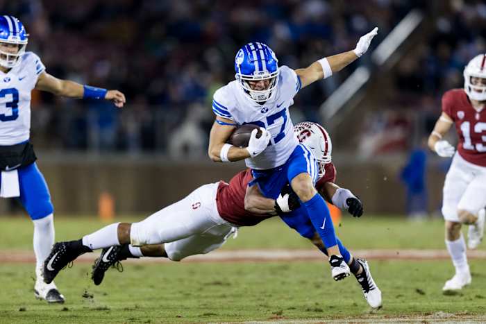 Stanford, California, USA; Brigham Young Cougars wide receiver Chase Roberts (27) runs the ball against Stanford Cardinal defensive end Aeneas DiCosmo (0) during the first half at Stanford Stadium.